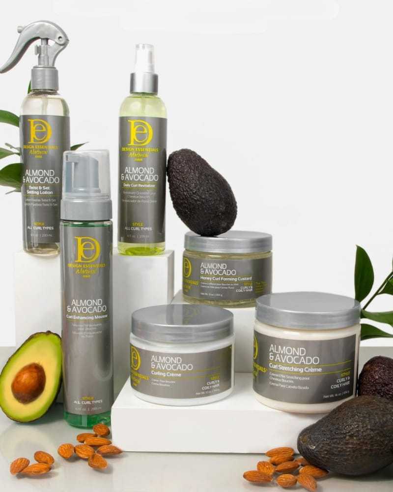 Haircare products with almond and avocado, featuring styling creams and fresh avocados.